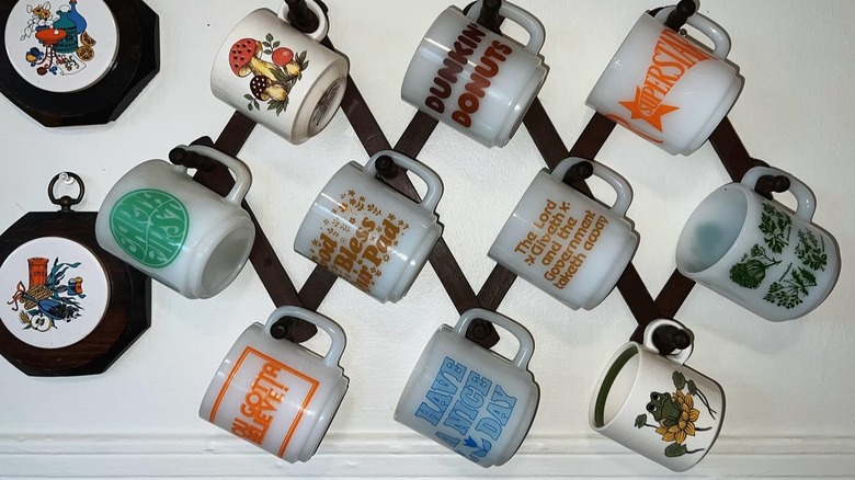 Mugs displayed on an old mug rack