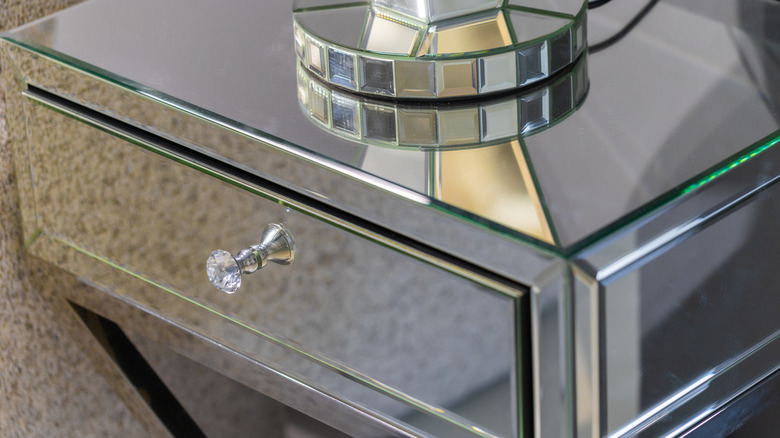 A mirrored nightstand.