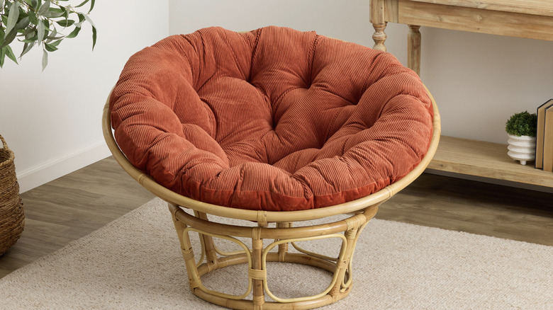 Orange papasan chair in living room