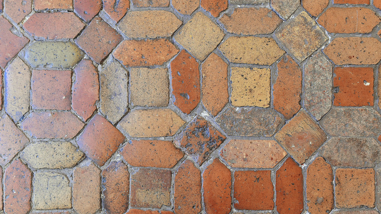 Uneven vintage tile with pickets and squares