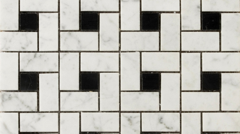 Pinwheel tiles with a black square and white marble rectangles
