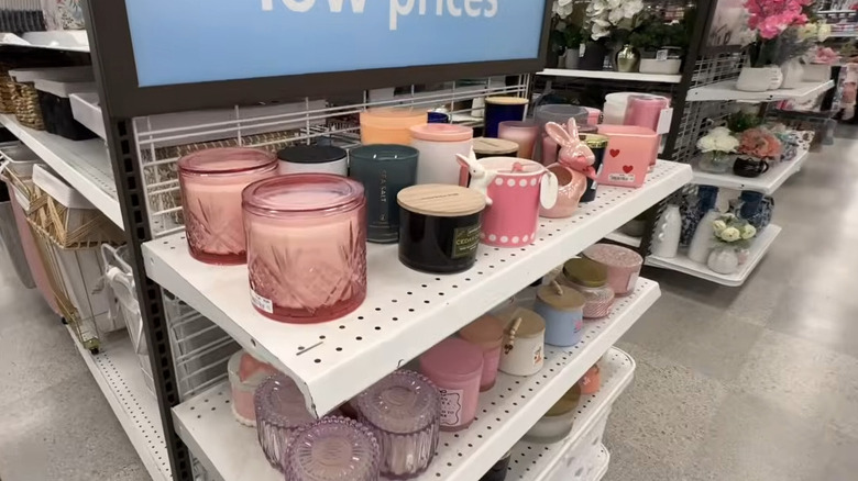 Pink and purple candles in glass holders on the endcap of a Ross Dress for Less