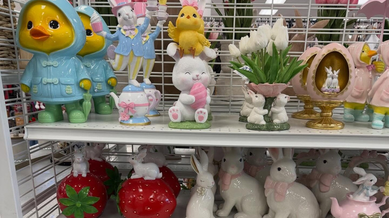 Easter decor featuring chicks, bunnies, and flowers on the shelves of a store
