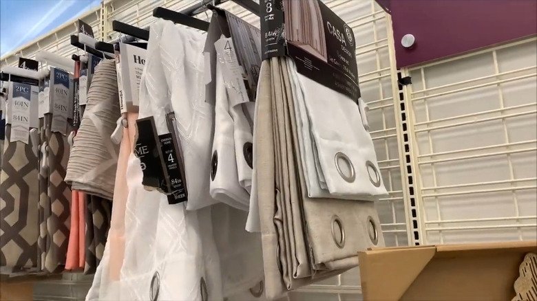 Shot of hanging curtains in neutral shades