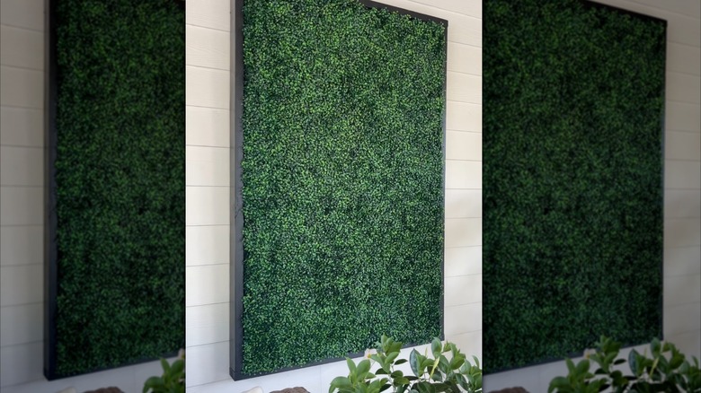 artificial boxwood panels can be used to hide electrical outlets