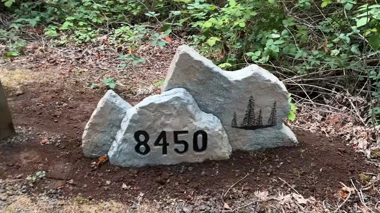 a DIY faux rock with an engraved address