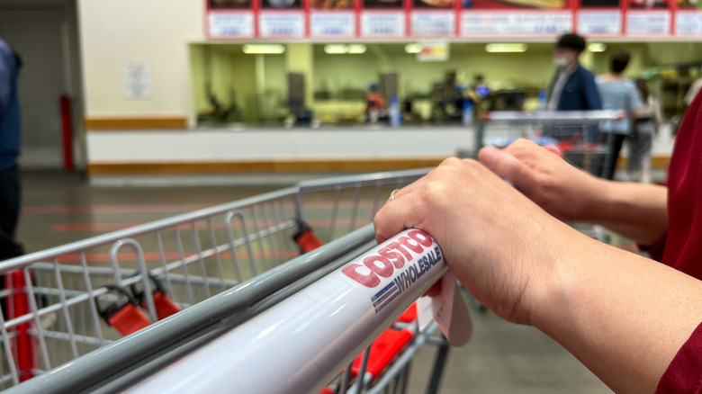 Shopper pushing cart in Costco food court