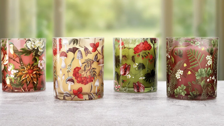 Four patterned candles on countertop