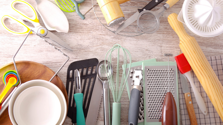 Kitchen utensils spread out over a kitchen countertop