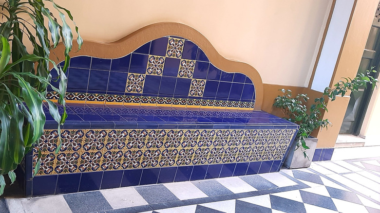 Blue and white checkerboard-style floors with a matching bench