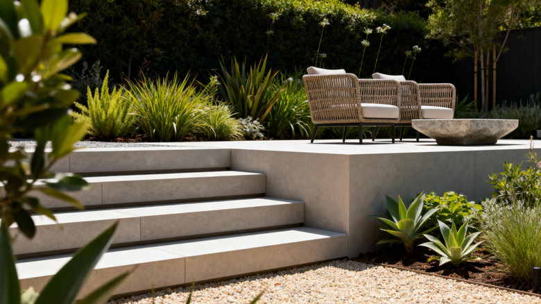 A patio built on a height with steps leading the way