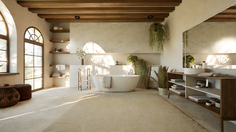 A large bathroom with wood beam ceiling.