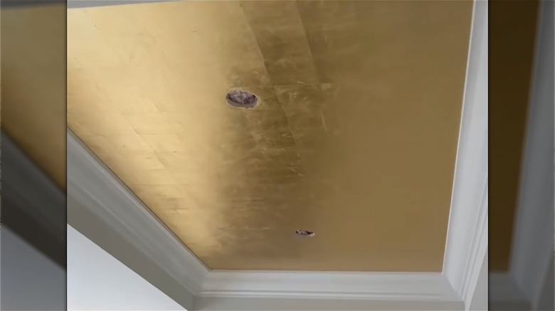 Gold leaf wallpaper on ceiling