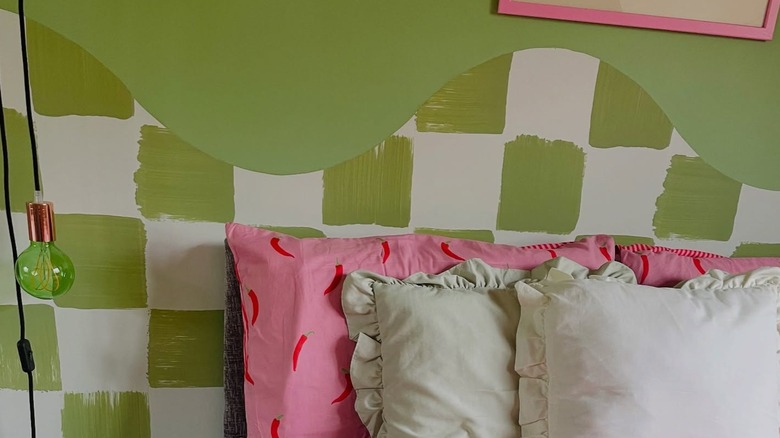 A green and white checkered wavy headboard.