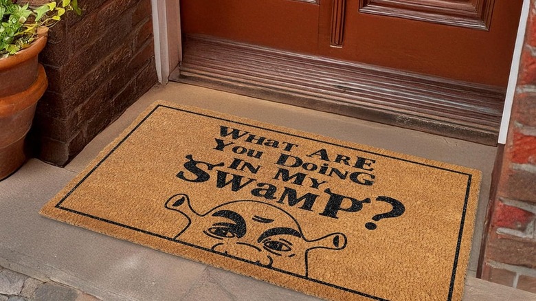 A door mat with a funny phrase from the movie "Shrek."