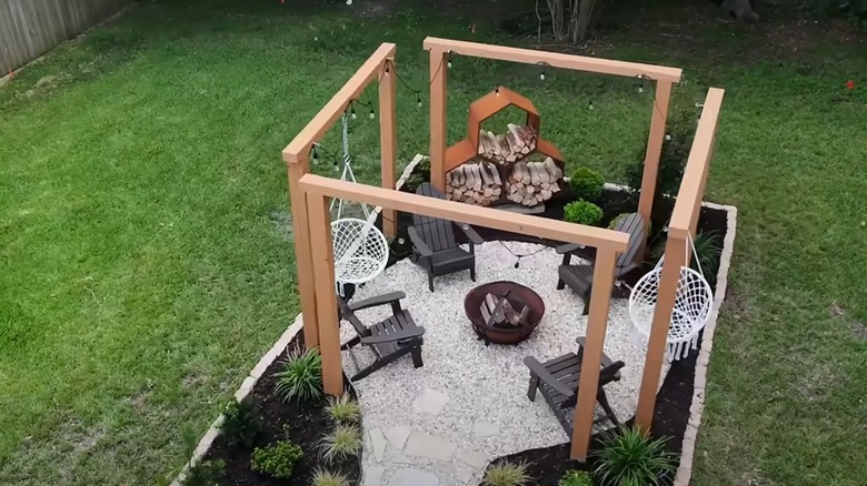 Hardscape patio with a fire pit in the center