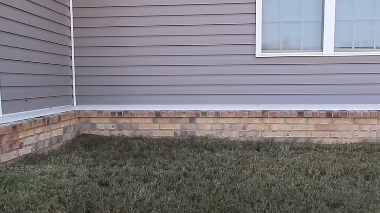 Outside corner of a house with grass