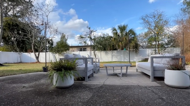 Slab of concrete with patio furniture