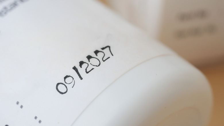 Close up of expiration date on bottle