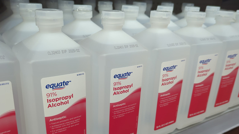 Close up of rubbing alcohol bottles on store shelf