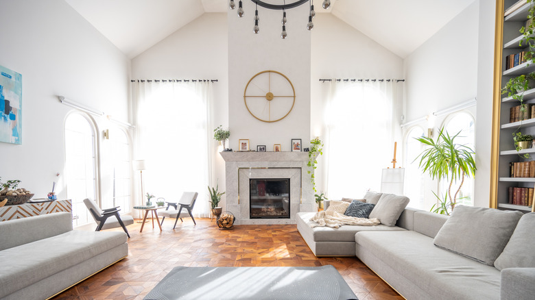 large living room with a barn style vaulted ceiling