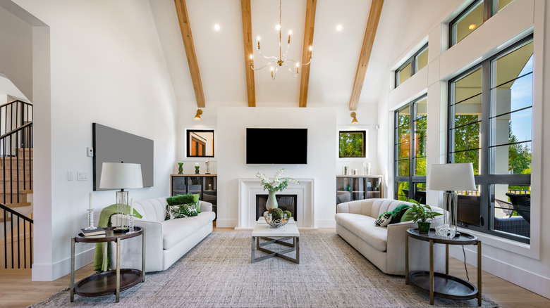 Vaulted ceiling with a large chandelier in the middle
