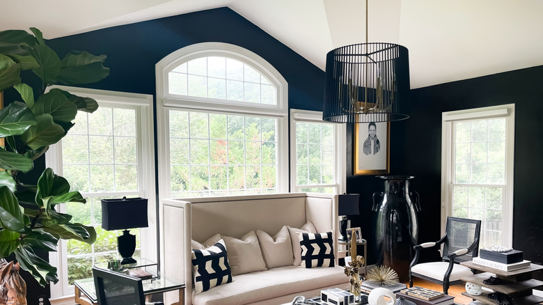 Contemporary home with dark blue walls and a vaulted ceiling