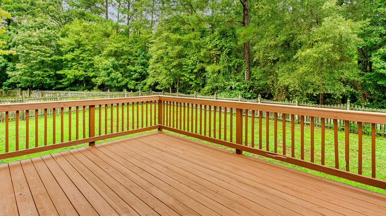 Large wooden deck in a backyard