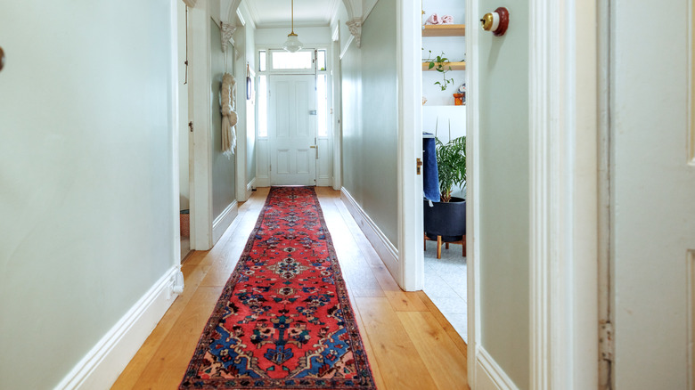 A bold and beautiful rug laid out in front of a home's entryway