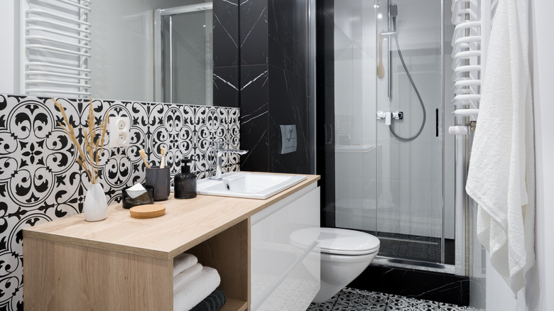 Multiple tile patterns monochrome bathroom