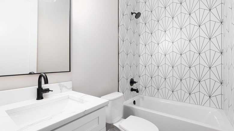 White bathroom black patterned shower