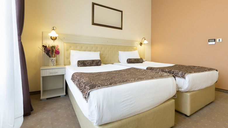 refined room with two beds