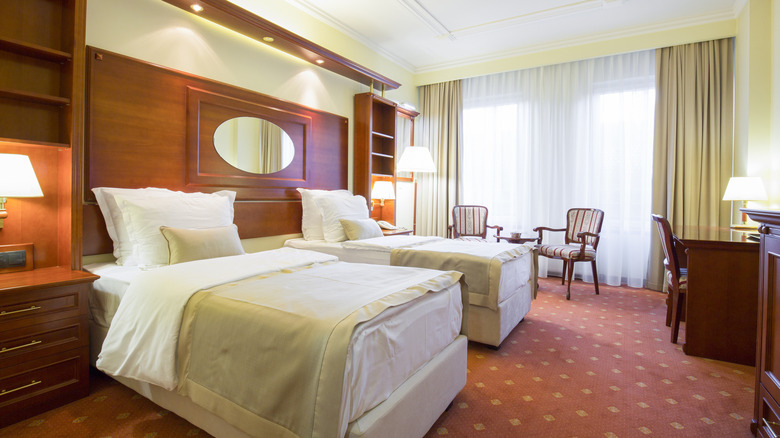 wood-filled room with two beds