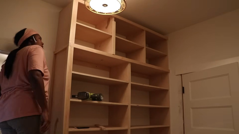 built in storage for shoes in a walk in closet diy project