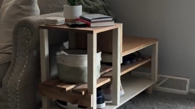 a multifunctional bench is an end table, bench, and shoe rack
