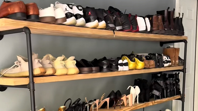 shelves in the garage made with pipe frames and wood planks