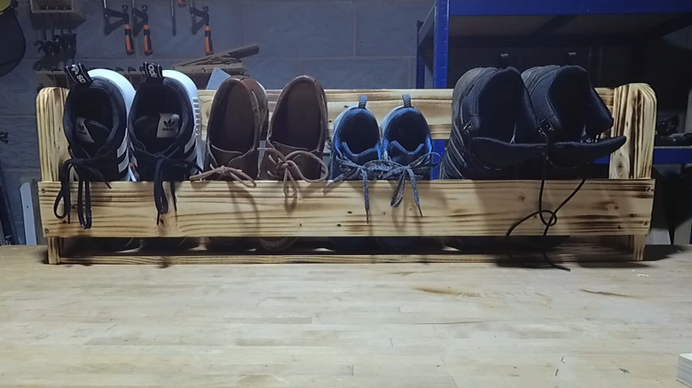 a pocket-style wall holder for wall mounted shoe storage
