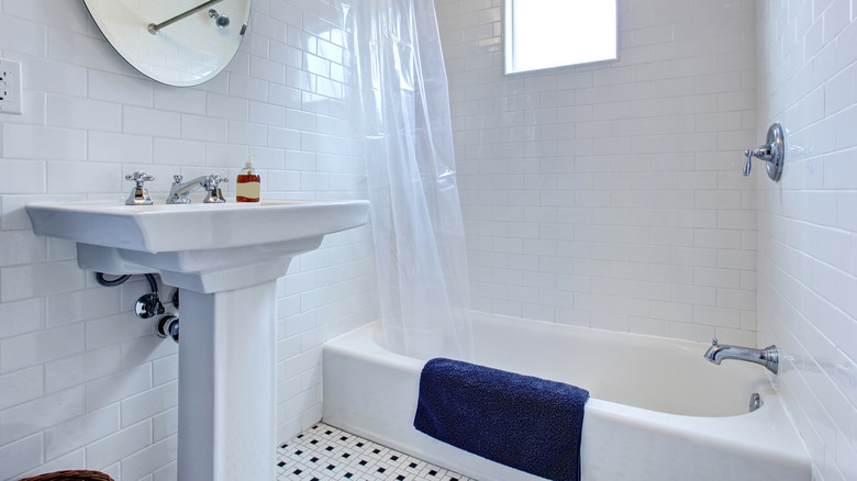 white pedestal sink in bathroom