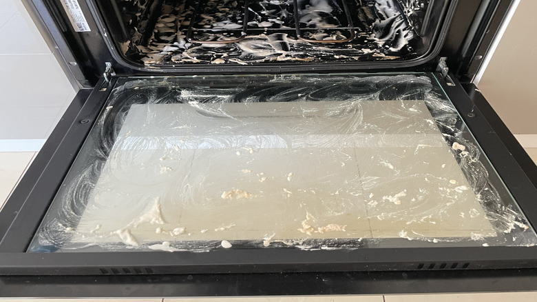 Baking soda paste applied on an opened oven.