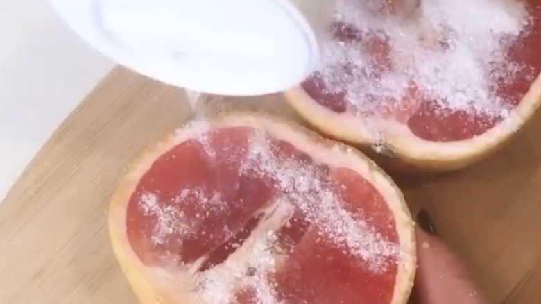Sliced grapefruit with salt on top.