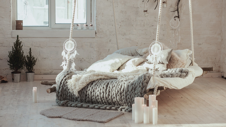 white candles next to bed