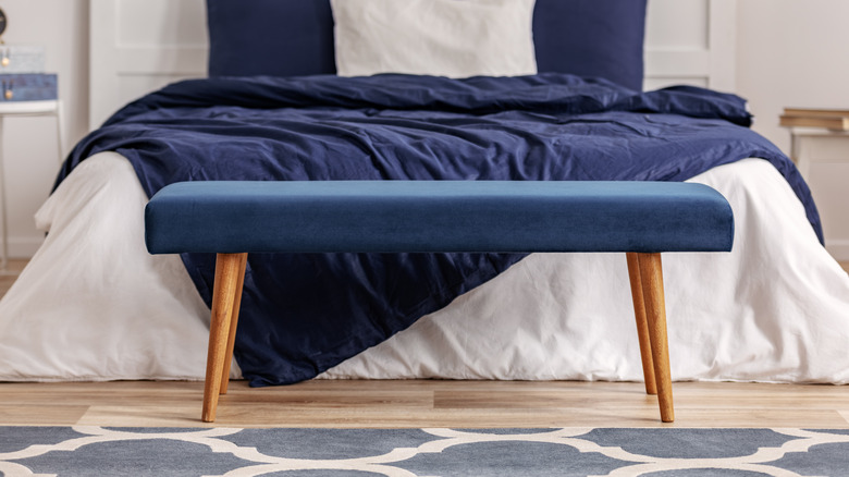 blue bench near blue bedding