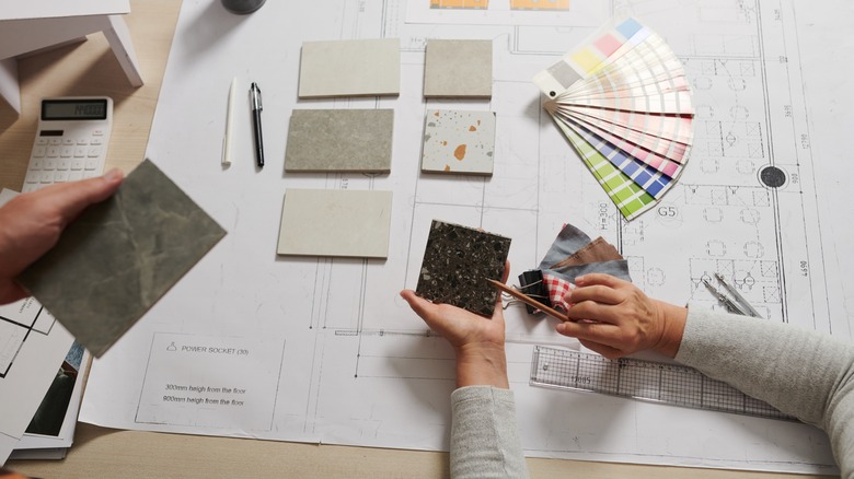 Designers looking at sample tiles