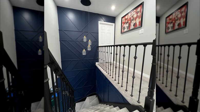 blue geometric accent wall on staircase wall