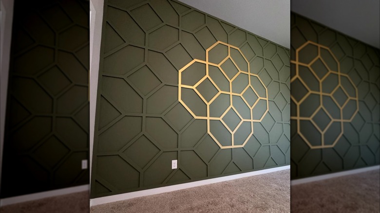 olive green accent wall with geometric gold accent marks
