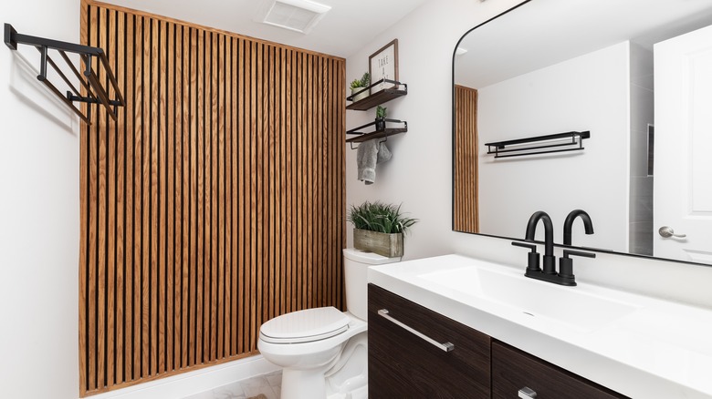 wood paneling accent wall in bathroom