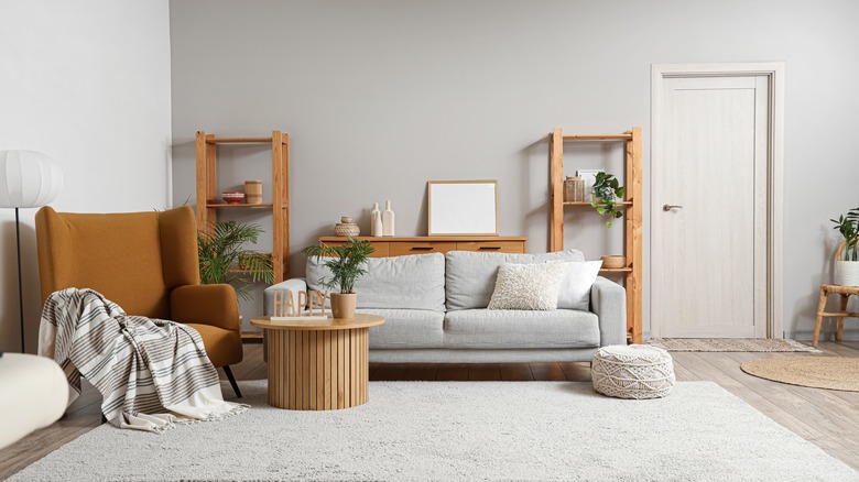 living room with furniture pieces, decor, and gray walls