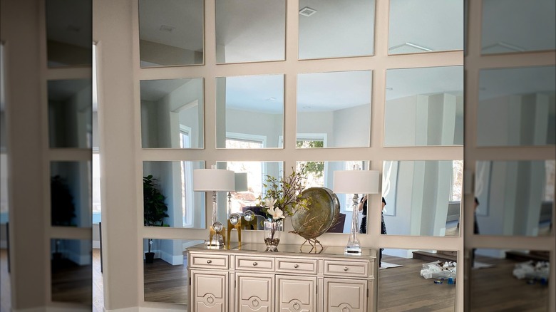 square panels of mirrors on wall as an accent
