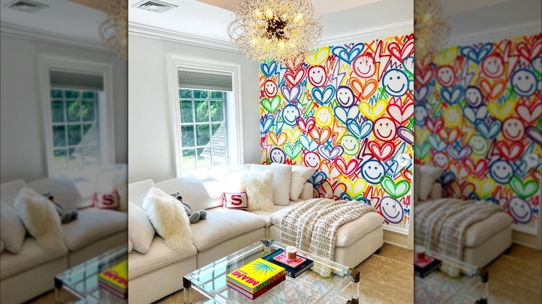 rainbow heart and happy face painted mural in living room