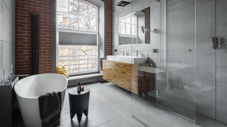 bathroom with red brick wall